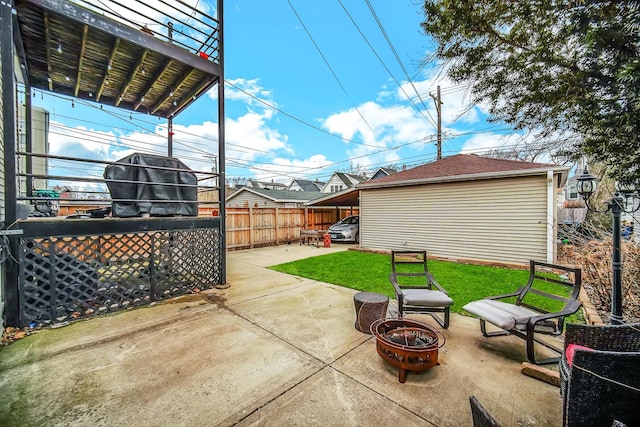 view of patio featuring fence and an outdoor fire pit