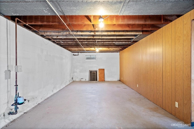 unfinished below grade area with wooden walls