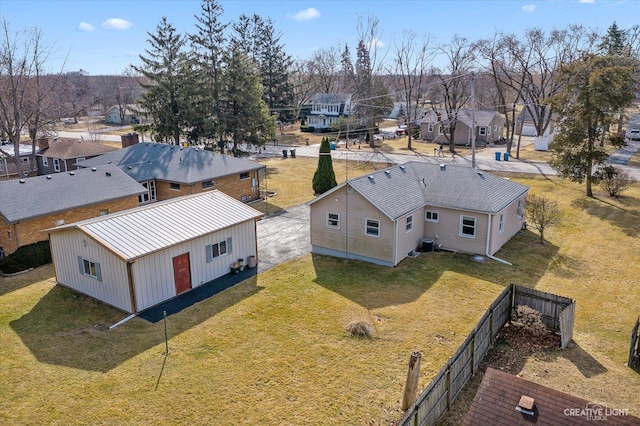 birds eye view of property with a residential view