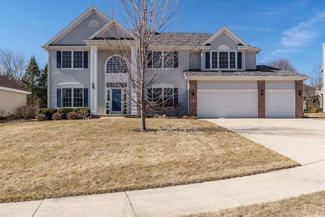 view of front of property with a garage, brick siding, concrete driveway, and a front yard