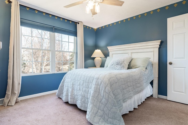 bedroom featuring a ceiling fan, baseboards, and carpet floors