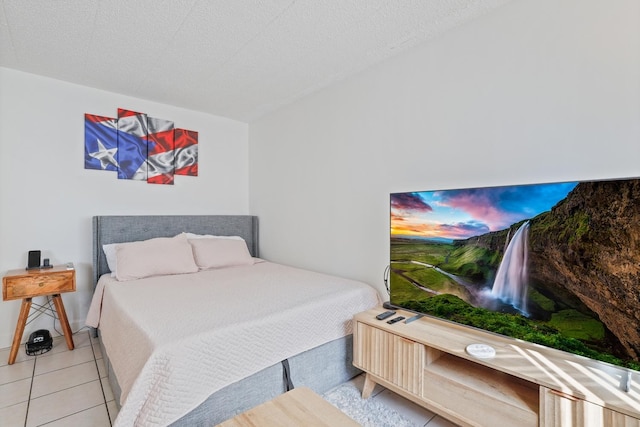 tiled bedroom with a textured ceiling