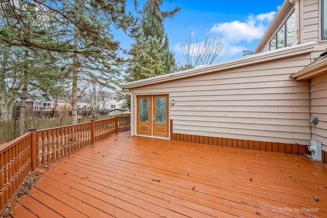 wooden deck featuring french doors