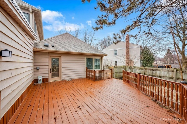 wooden deck featuring fence