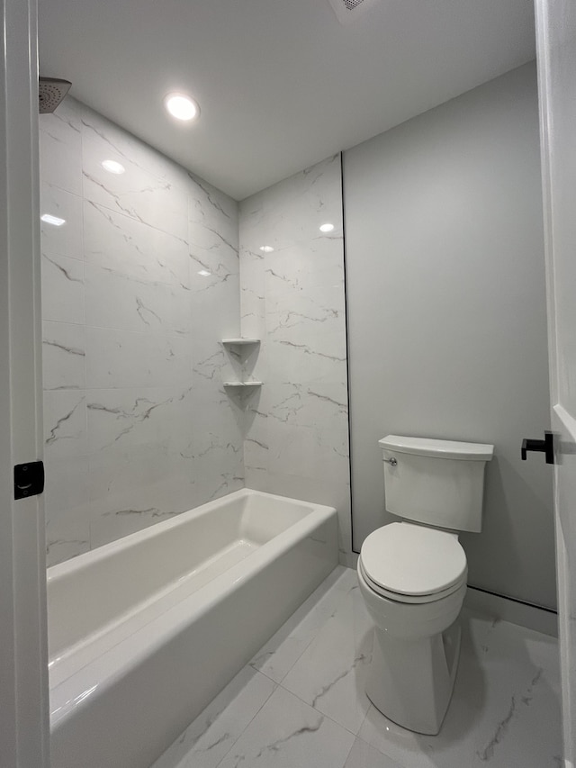 full bath with shower / tub combination, toilet, recessed lighting, and marble finish floor