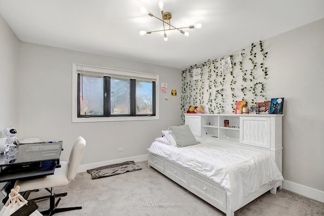 carpeted bedroom featuring baseboards and a chandelier