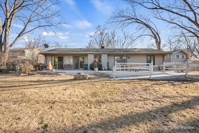 ranch-style home with a patio and fence