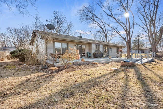 view of front of property featuring a patio area and french doors