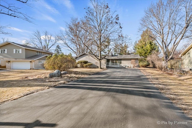 view of front of property featuring aphalt driveway