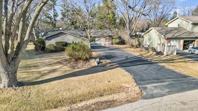 view of road with aphalt driveway