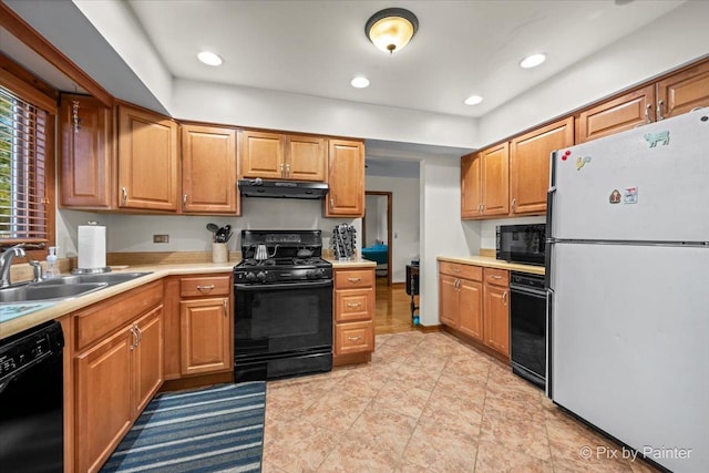 kitchen with ventilation hood, recessed lighting, a sink, black appliances, and light countertops