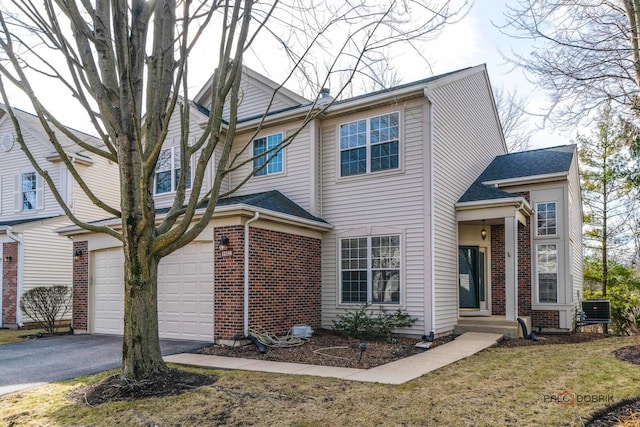 view of front of house with aphalt driveway, brick siding, central AC unit, and a shingled roof