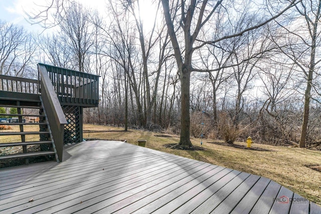 wooden terrace with stairway and a lawn