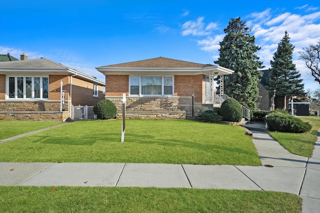 view of front of house with stone siding and a front lawn