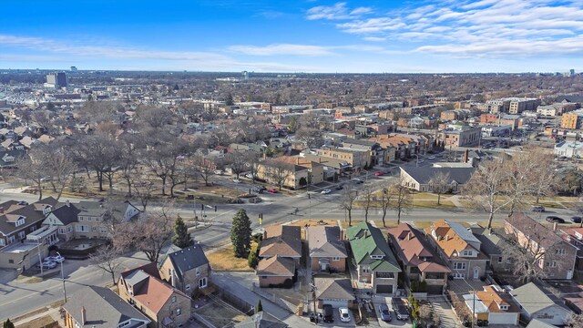 birds eye view of property with a residential view