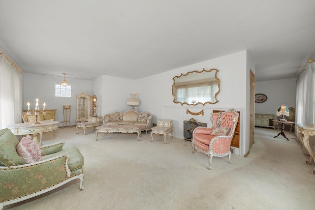 living area with carpet and a wealth of natural light