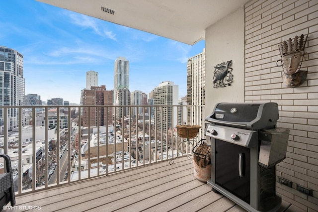 balcony featuring grilling area and a city view