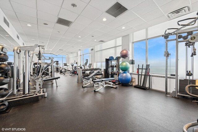 workout area with visible vents and a healthy amount of sunlight