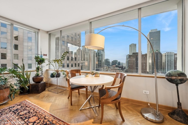 sunroom featuring a city view