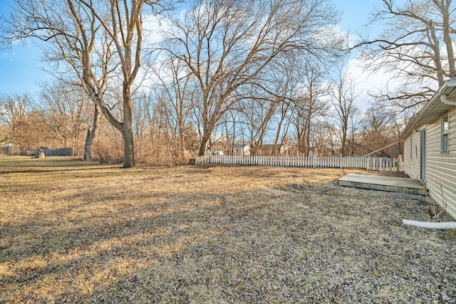 view of yard with a wooden deck and fence