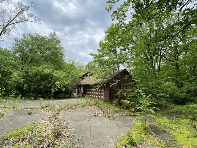 view of side of property featuring a garage