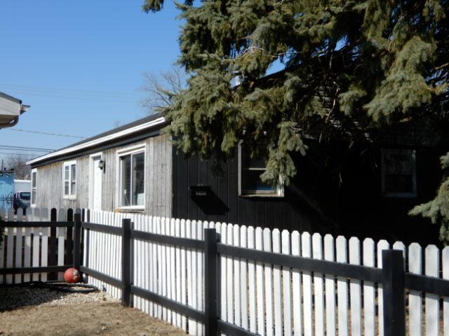 view of side of home with fence