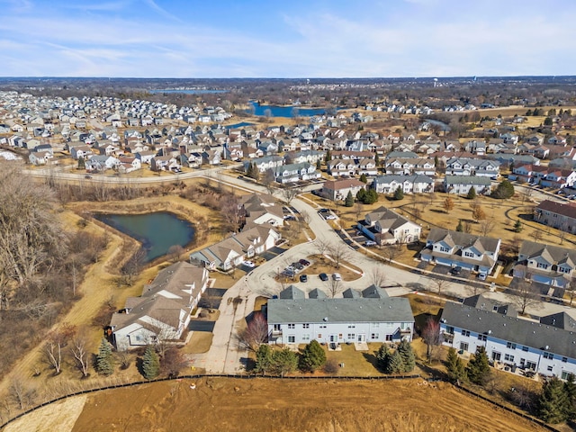 aerial view with a residential view and a water view