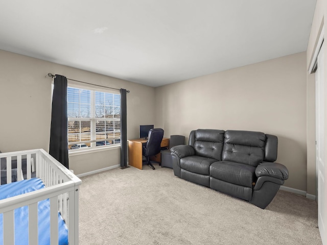 bedroom featuring carpet and baseboards