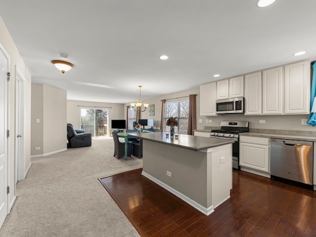 kitchen with recessed lighting, open floor plan, a healthy amount of sunlight, and stainless steel appliances