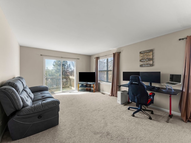 office with baseboards and carpet floors