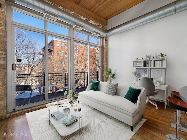2333 W Saint Paul Ave Unit 331, Chicago, IL 60647 - living room with wood ceiling, wood finished floors, and a high ceiling