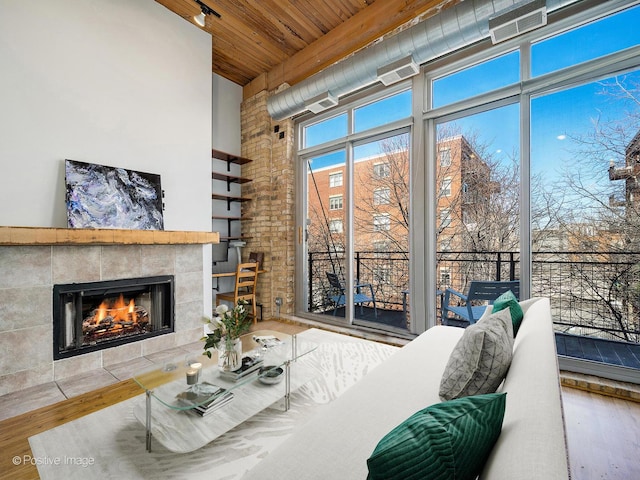 2333 W Saint Paul Ave Unit 331, Chicago, IL 60647 - living room with wooden ceiling, a towering ceiling, wood finished floors, and a fireplace