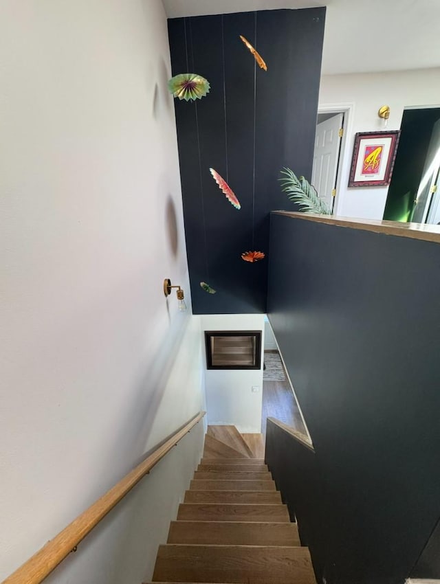 stairway with wood finished floors