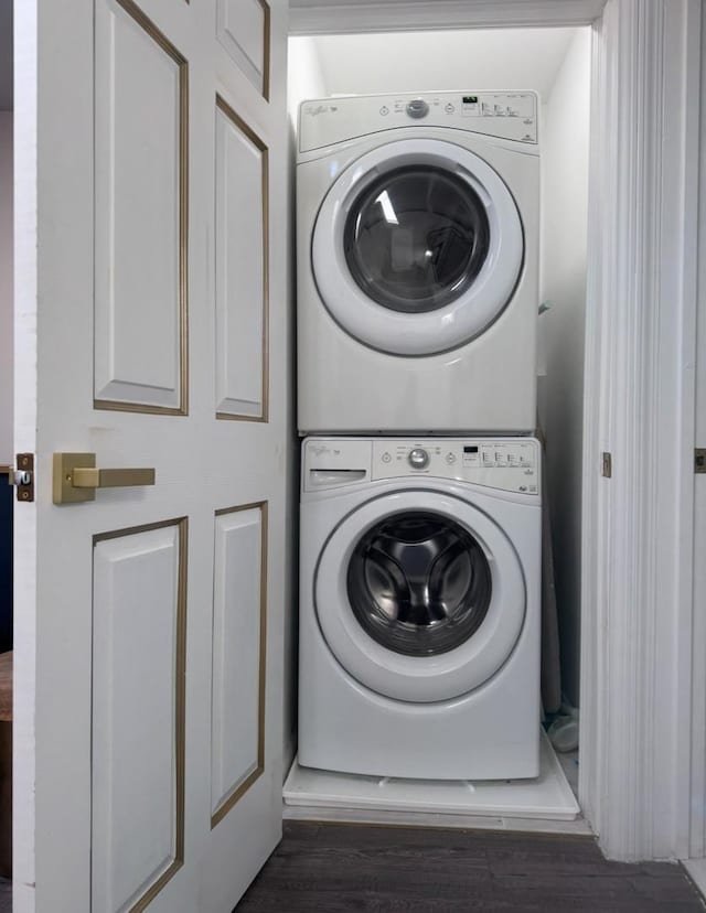 washroom featuring laundry area and stacked washer / dryer