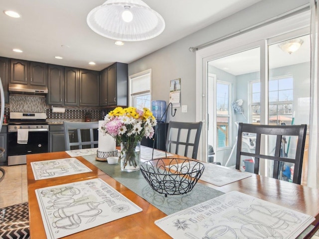 dining space with recessed lighting