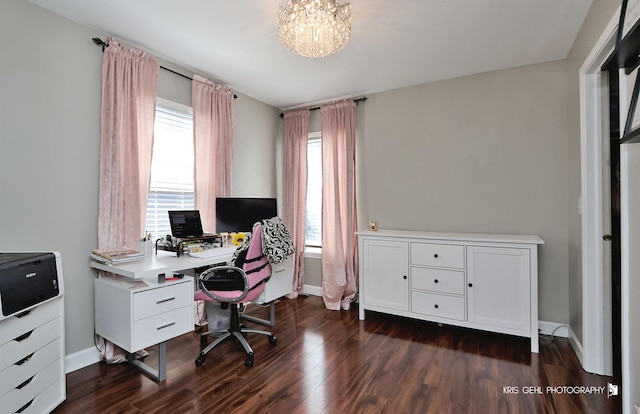 office area with dark wood-type flooring, baseboards, and a chandelier