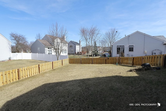 view of yard with a fenced backyard