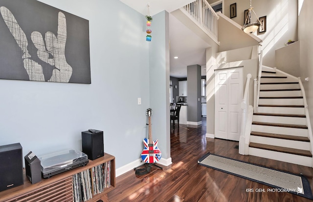 stairway featuring baseboards and wood finished floors