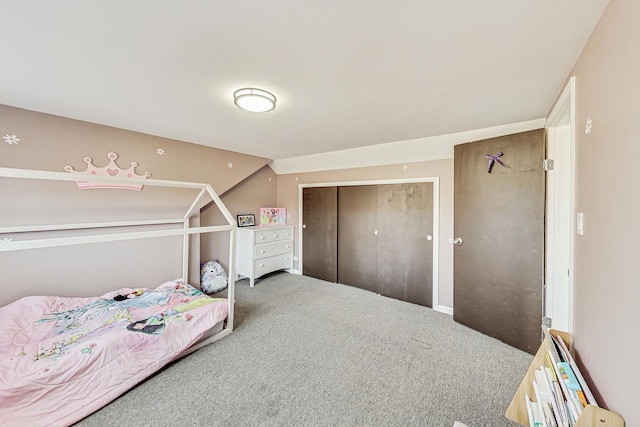 bedroom with a closet and carpet floors