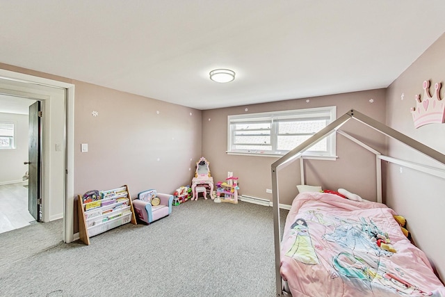 carpeted bedroom with a baseboard heating unit and baseboards