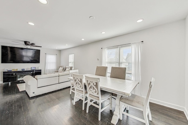 dining room featuring recessed lighting, baseboards, and wood finished floors