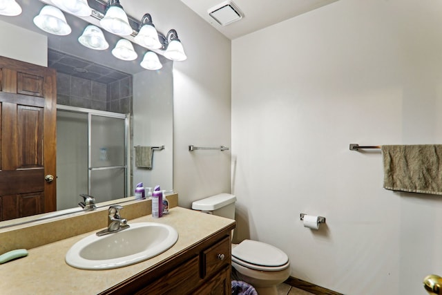 full bathroom with vanity, toilet, visible vents, and a stall shower