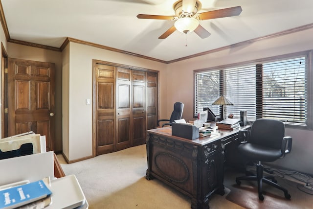 office space featuring crown molding, light colored carpet, baseboards, and ceiling fan