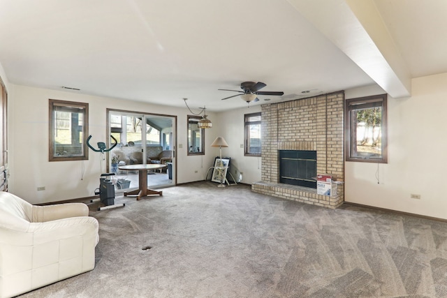 unfurnished living room featuring baseboards, carpet, and a fireplace