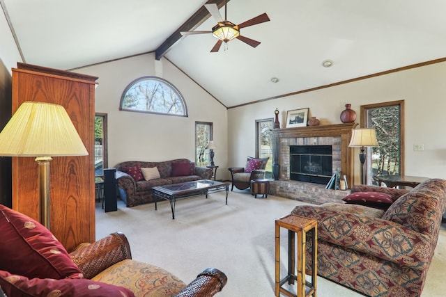 carpeted living area with a brick fireplace, crown molding, ceiling fan, beam ceiling, and high vaulted ceiling