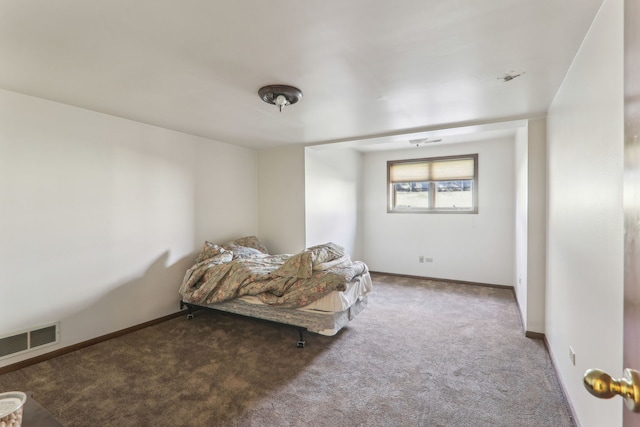 bedroom featuring visible vents, baseboards, and carpet flooring