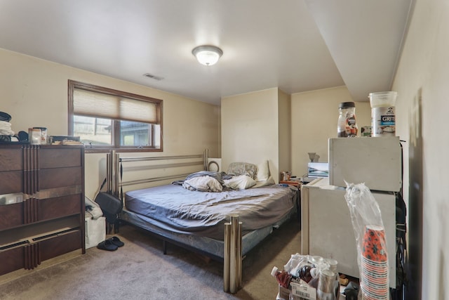 carpeted bedroom with visible vents