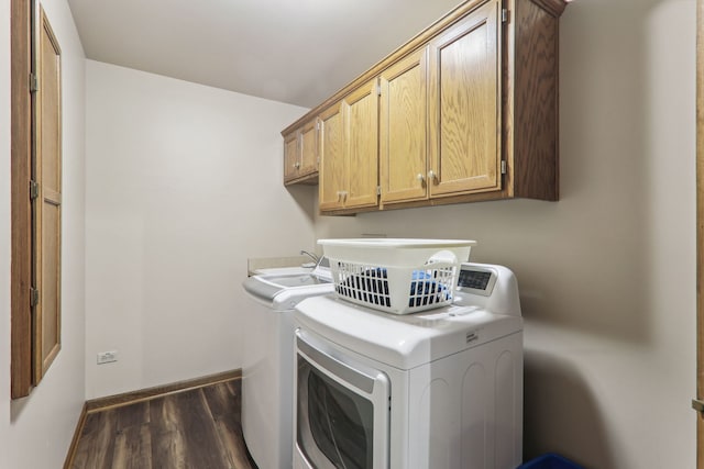 laundry room featuring baseboards, cabinet space, separate washer and dryer, and wood finished floors