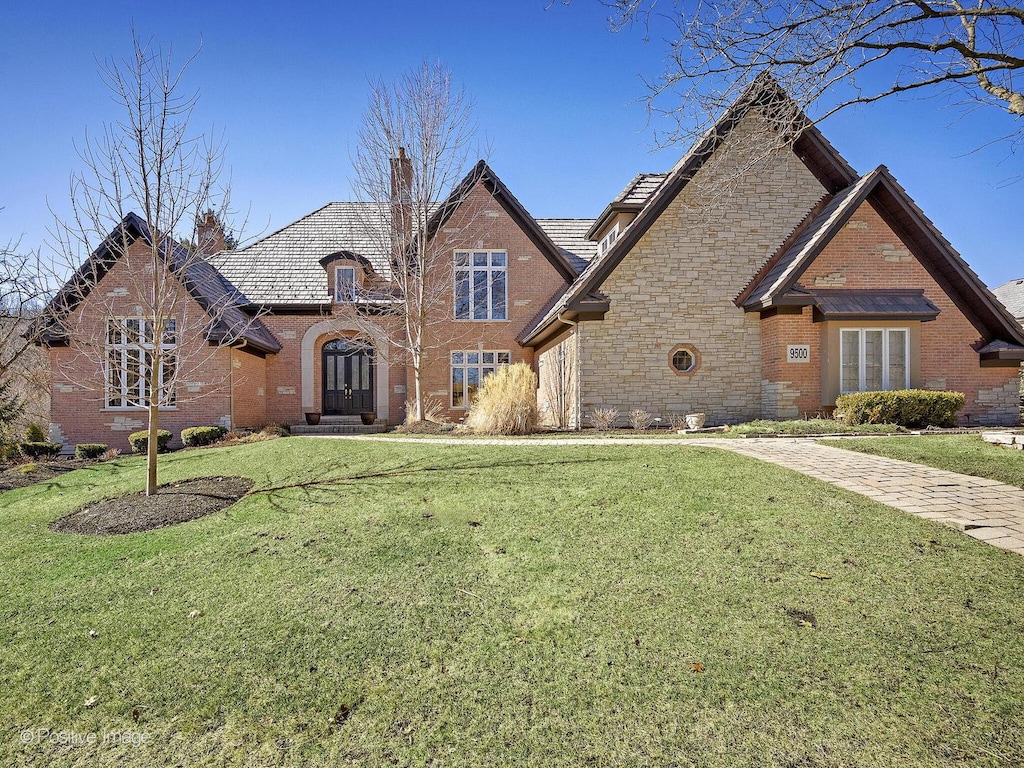 9500 Falling Waters Dr E, Burr Ridge, IL 60527 - view of front of property with brick siding, a front lawn, and a chimney