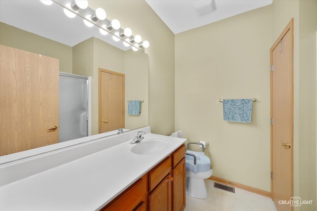 bathroom featuring visible vents, toilet, a stall shower, baseboards, and vanity